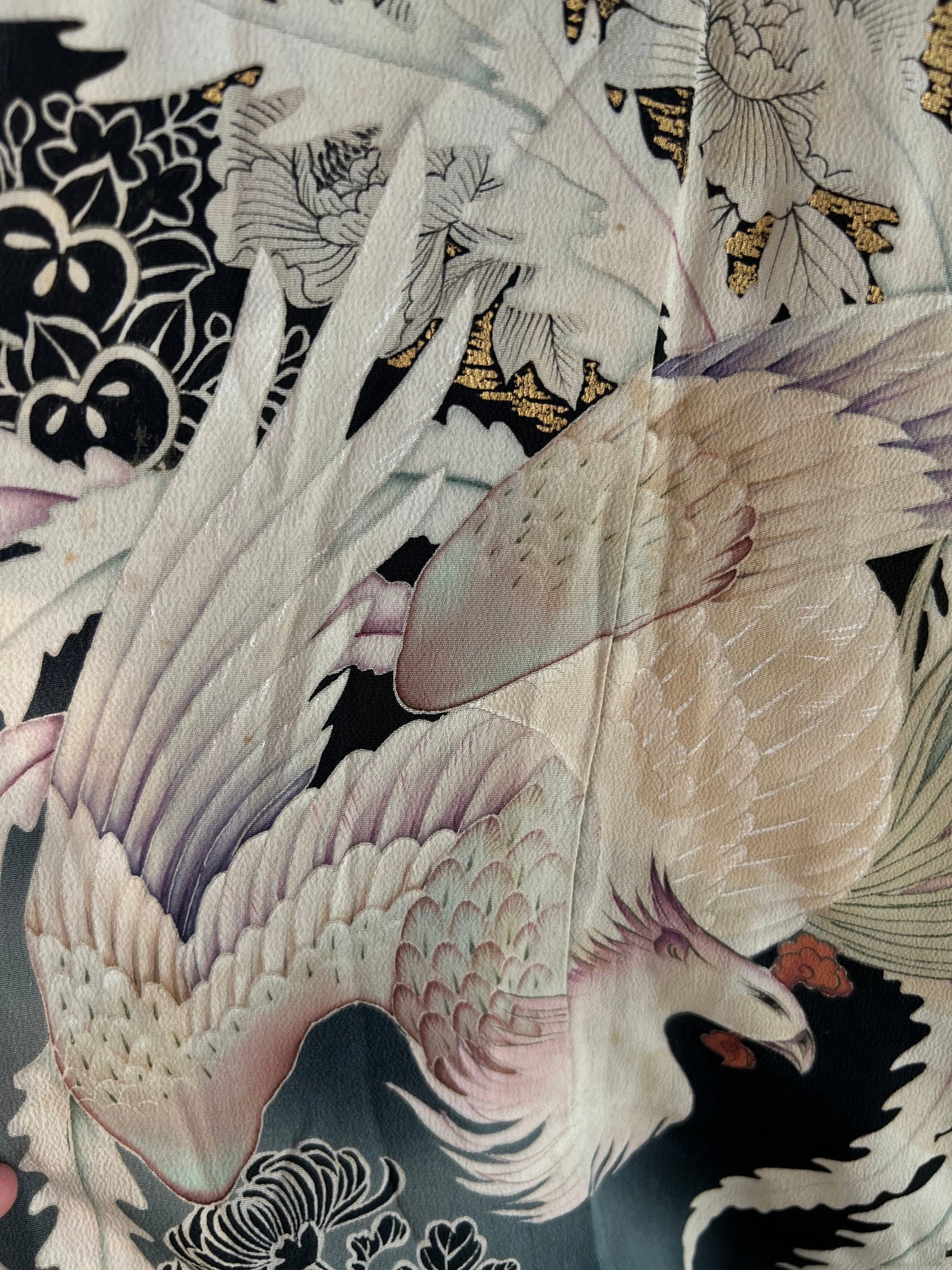 Black antique kimono with phoenix pattern close up